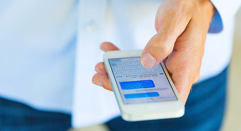 Man checking phone messages.