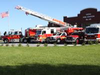 3 fire trucks, an ambulance, and fire rescue vehicle in front of Station 48