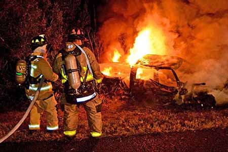 Firefighters and car fire Firefighters and car fire