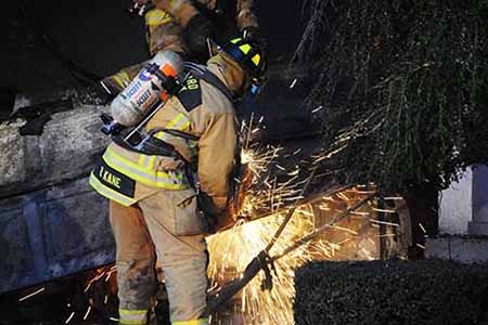 Firefighter using torch