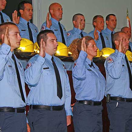 Fire Rescue graduating class taking the oath