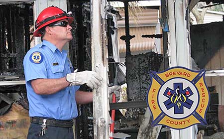Inspector-Photo Inspector looking at fire damage.
