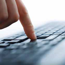 Pushing Button Pushing button on a laptop.