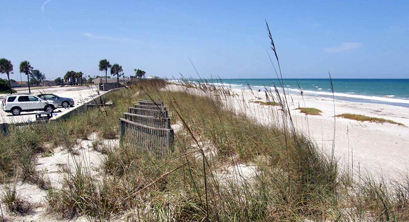 Parking lot of the Officer's club. The sea wall has been replaced by a dune and fencing and the shoreline now apears to be 50+ yards away.