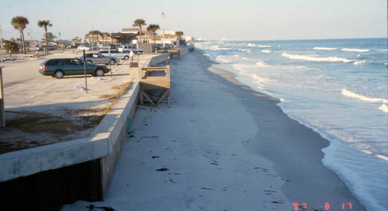 Parking lot of the Officer&#39;s club. The shoreline appears to be within 10 yard of the sea wall.