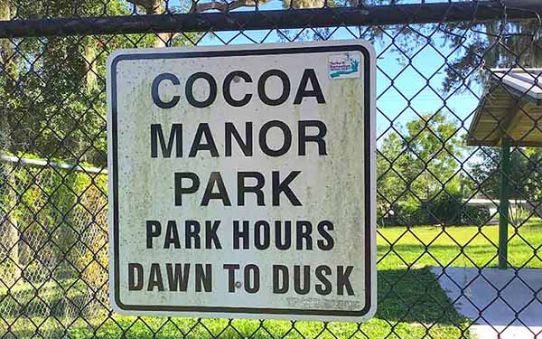Cocoa Manor Park Sign. Park hours dawn to dusk.