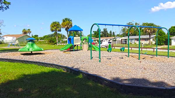 Playground swings, slides and merry-go-round
