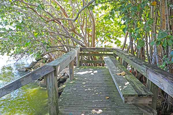 Waterfront deck with bench.