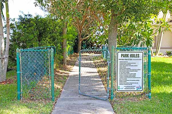 Gate with park rules sign.