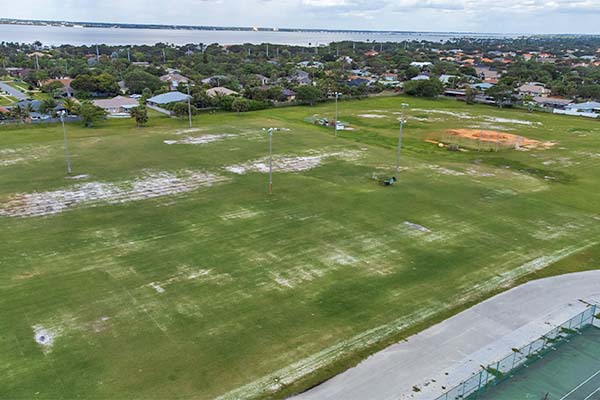 Aerial view of open fields and baseball field.