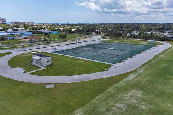 Tennis courts surrounded by a running track.