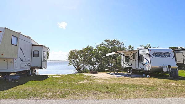 Campers near river.