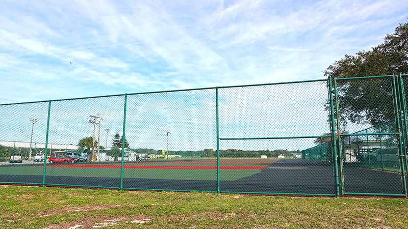 Fenced tennis courts