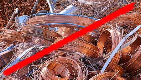 Line striking through pile of copper wire